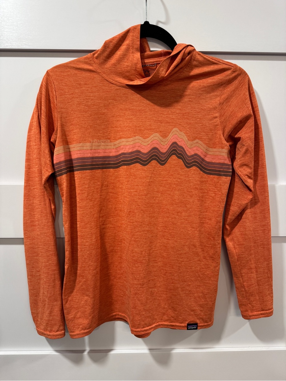 Patagonia women’s Orange Capilene Cool Daily Sun Hoodie